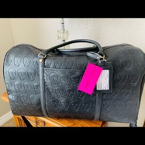 Betsy Johnson skull weekender duffel bag.